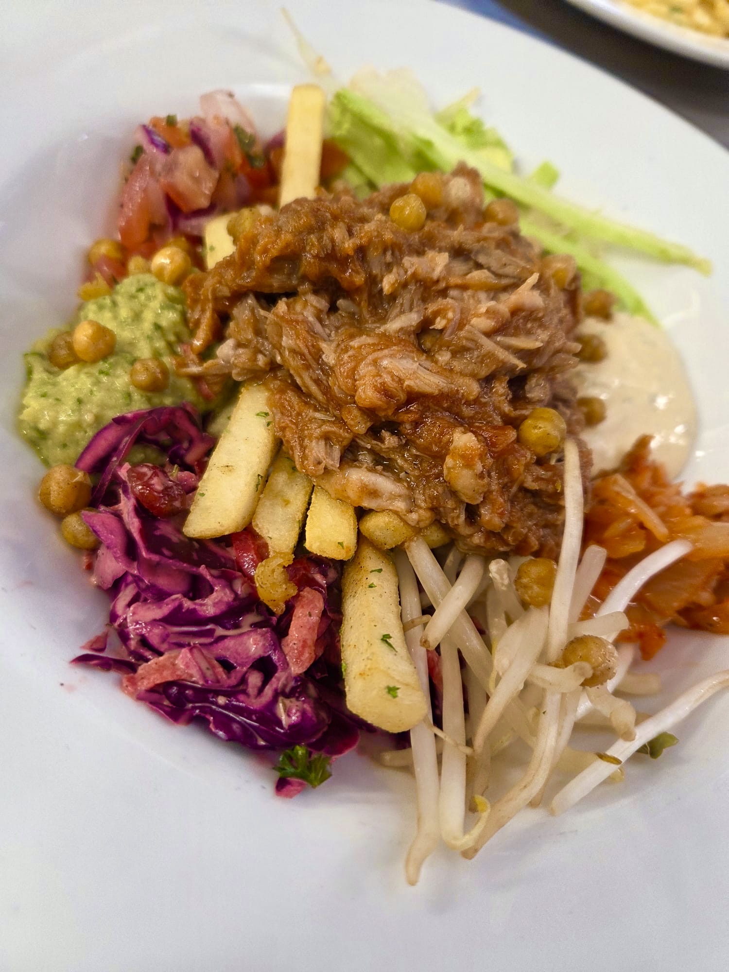 Big bowl with pulled pork, slaw and chickpeas